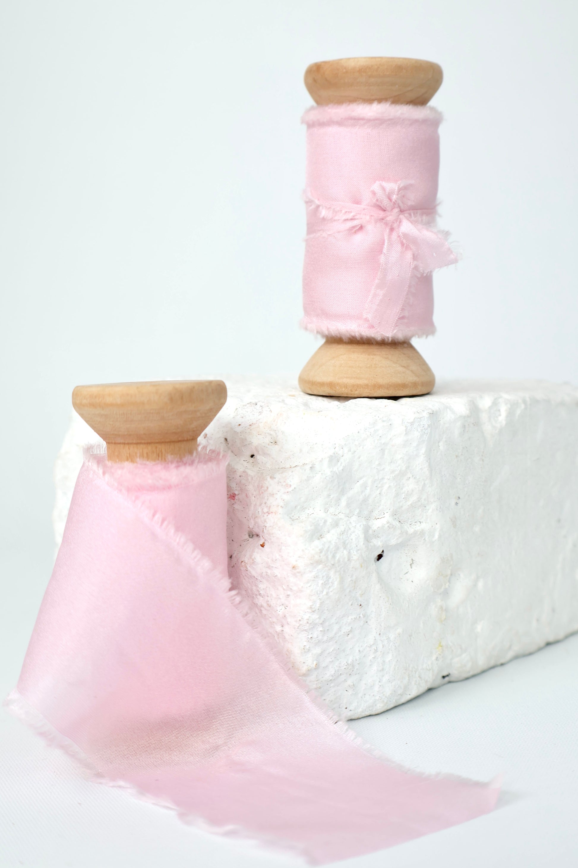 Two spools of baby pink 100% Habotai silk ribbon