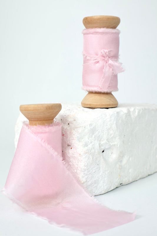 Two spools of baby pink 100% Habotai silk ribbon