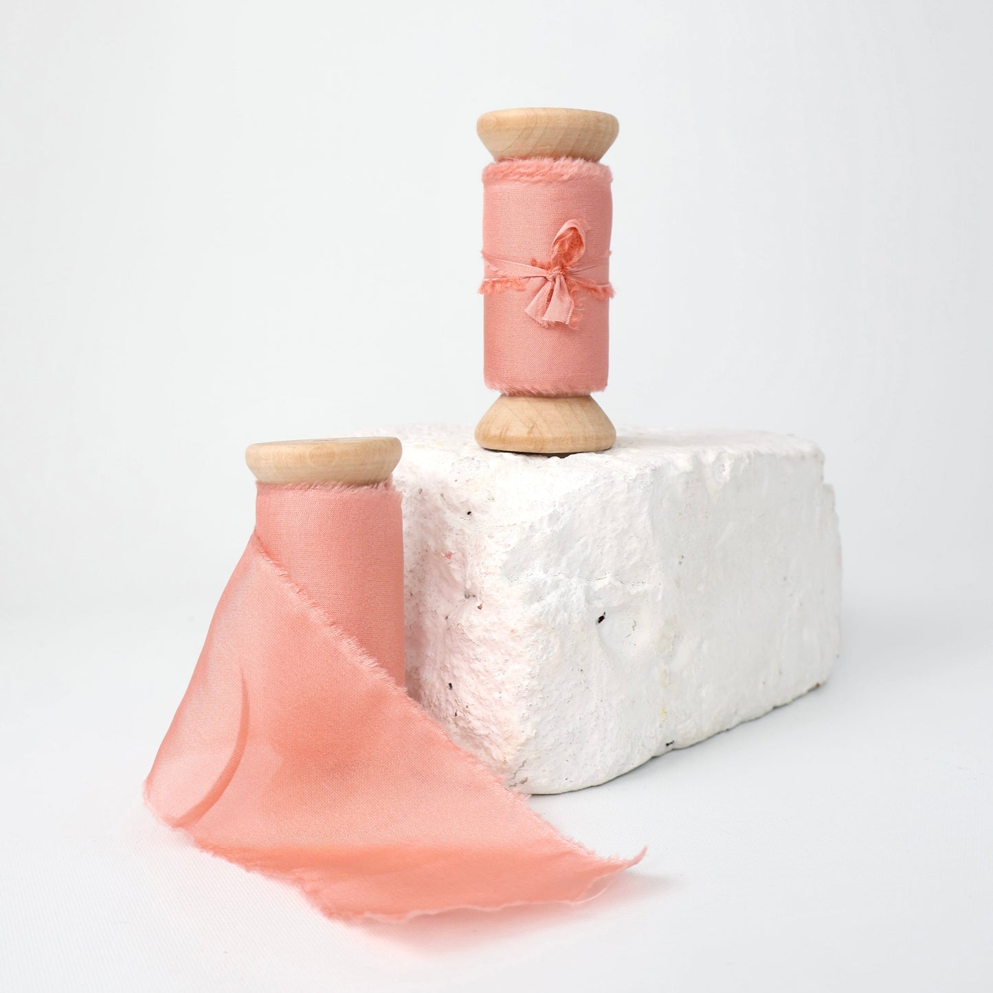 Two spools of Coral 100% Habotai Silk Ribbon for wedding bouquets and stationary